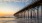 beach shot looking up at a pier