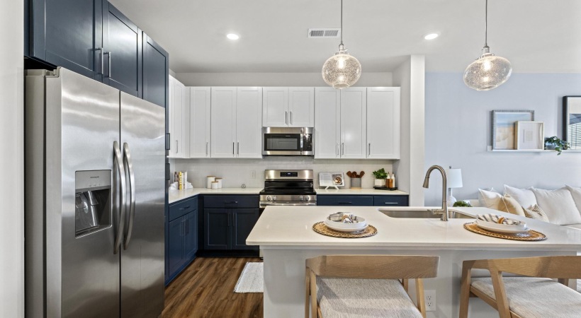 a kitchen with white cabinets