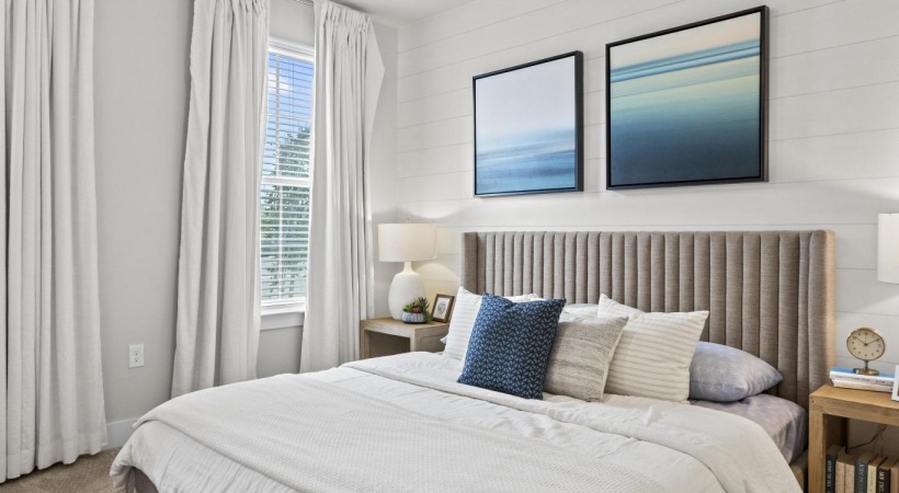 a bedroom with a bed and two nightstands