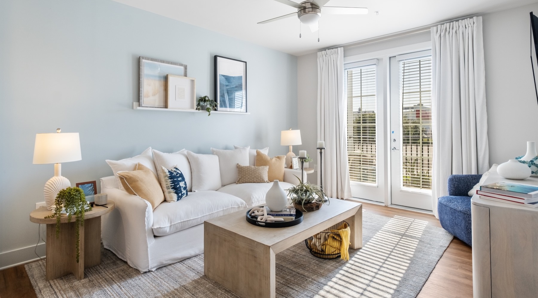 a living room with a white couch and a coffee table