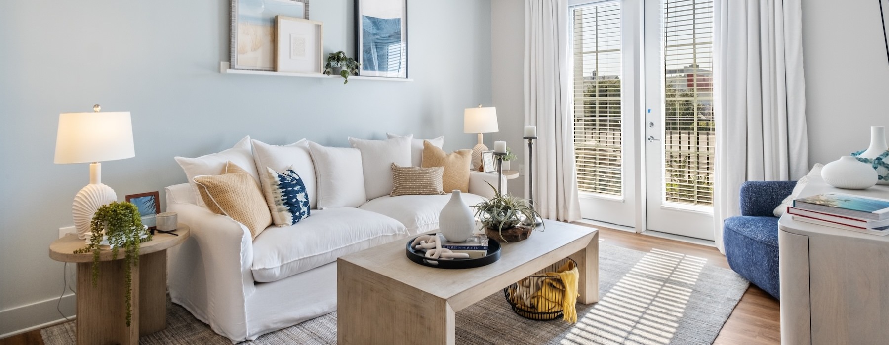 a living room with a white couch and a coffee table