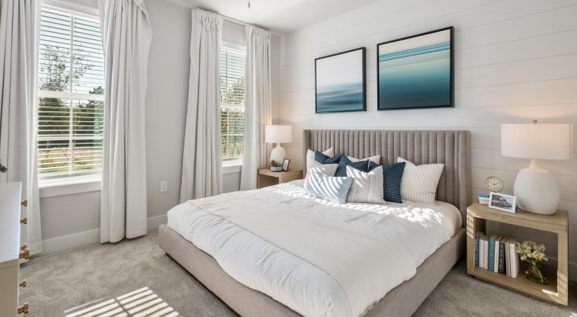 a bedroom with a bed and two nightstands